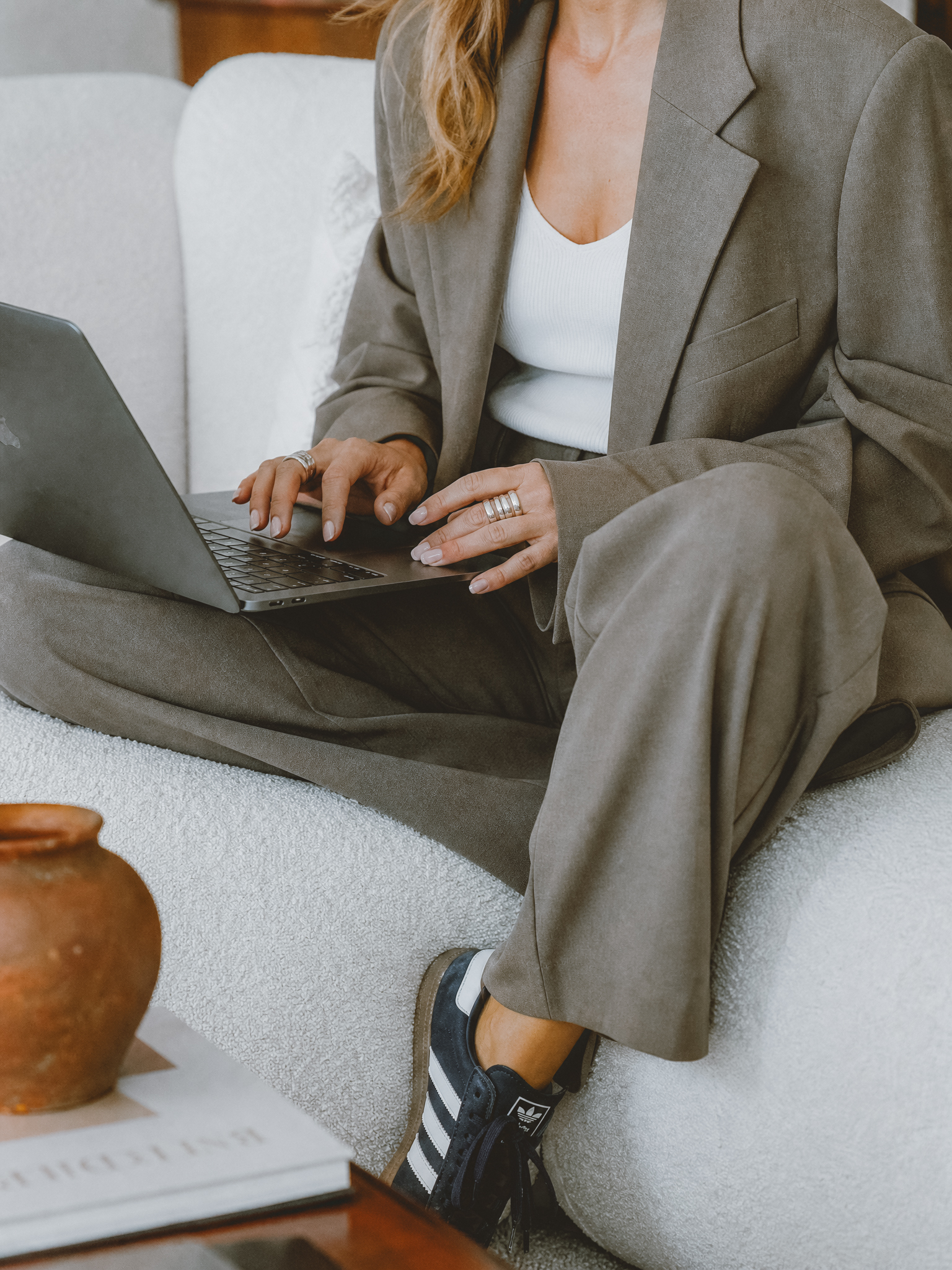 Woman working on a laptop while creating a photography website